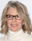 Diane Keaton sporting a medium length hairstyle with layers