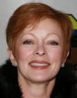 Frances Fisher wearing her red hair in a pixie style