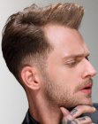 Guys hairstyle with an undercut and a small quiff